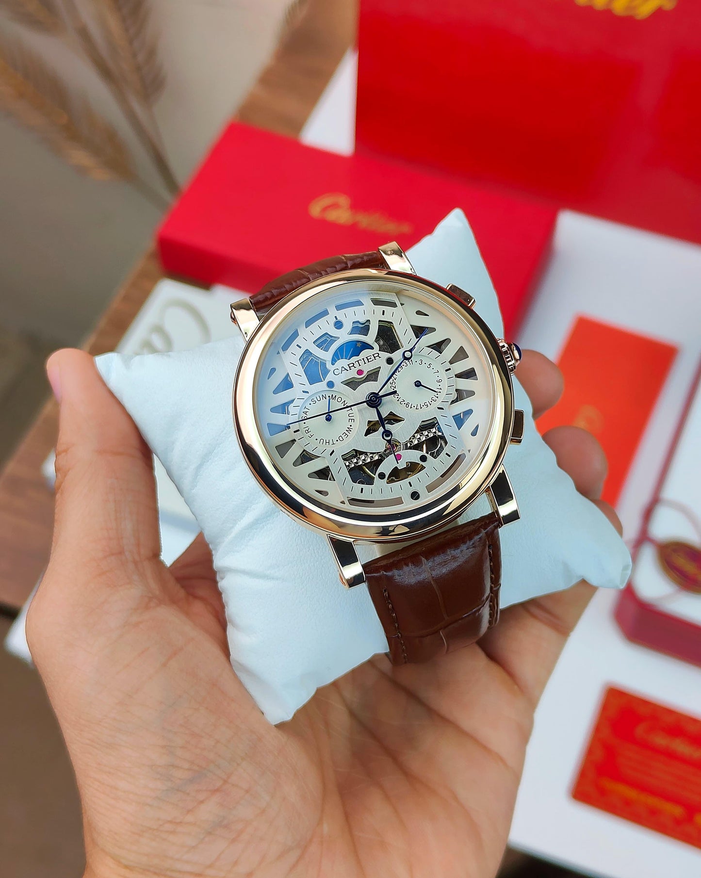 CA_TIER AUTOMATIC WATCH WITH A SKELETONIZED DIAL A BROWN LEATHER STRAP DAY AND DATE INDICATORS