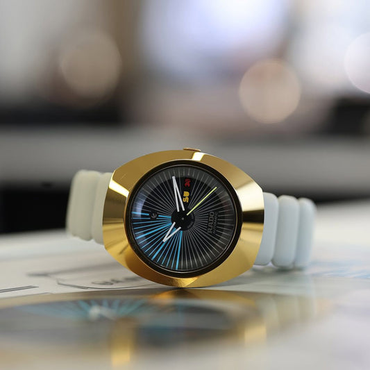 RA_O DIASTAR SPECIAL EDITION A YELLOW GOLD COLORED CERAMOS BEZEL A DISTINCTIVE PILLOW-SHAPED GRAY RUBBER STRAP